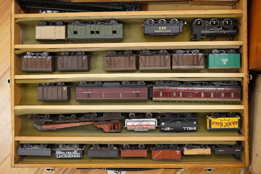 130 items of EM gauge model railway rolling stock contained within three handmade fitted wooden cases, two with removable trays, comprising three locomotives; an SR class 700 0-6-0 tender locomotive, 693, an SR 0-4-0T, 7